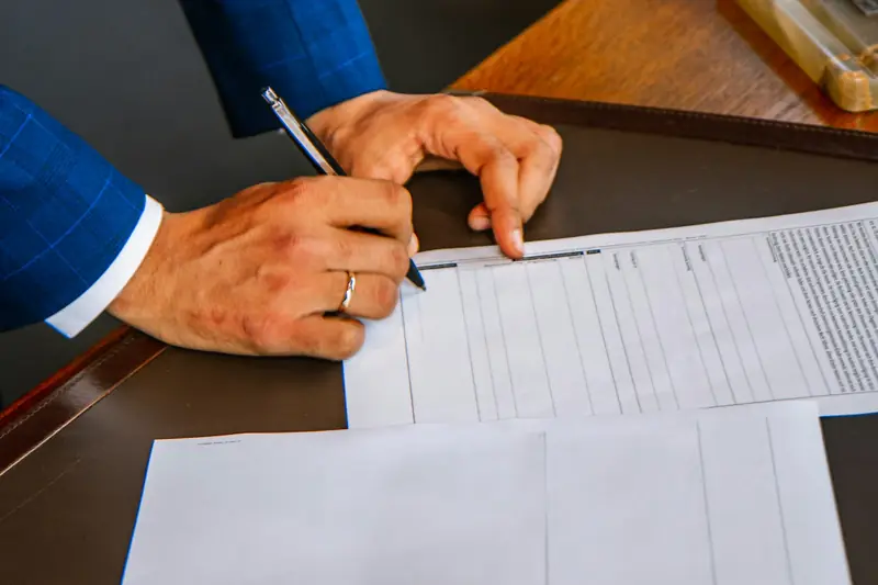 Person filling out an insurance claim form — South Dakota bad faith insurance lawyer